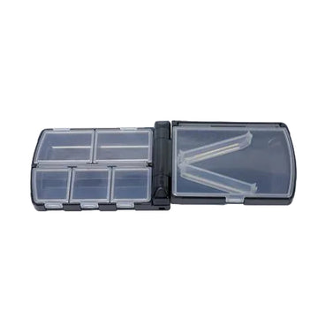 A small black and clear plastic organizer box shown open, with multiple small compartments and a coin placed beside it for scale, on a white background with repeated Meiho watermark text.